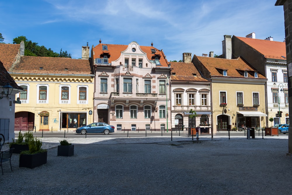 a group of buildings with a car parked in front of them