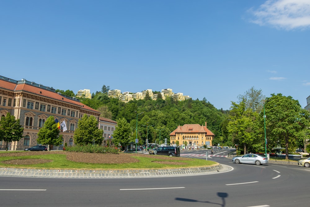 a city street with a hill in the background