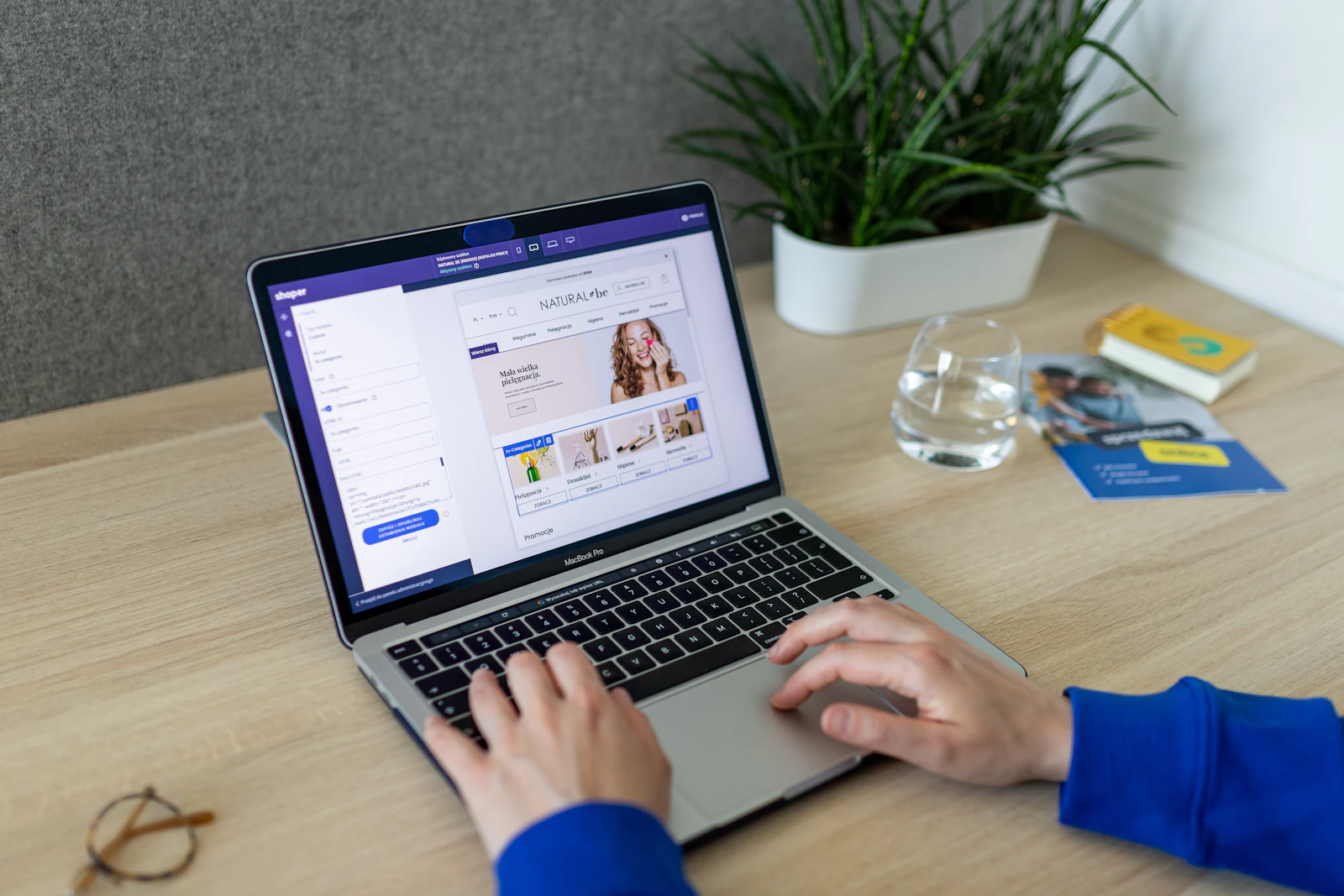 Digital product seller editing an ecommerce store on a laptop