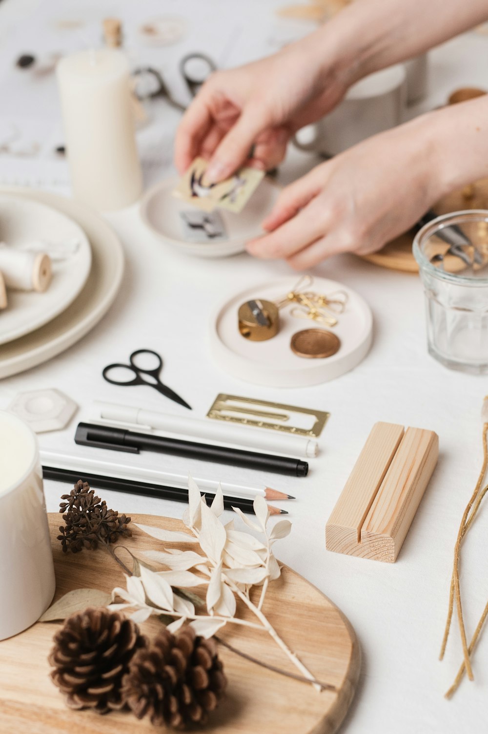 a table topped with lots of craft supplies