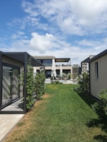 An outdoor smart-home setup featuring automated shading and rainwater collection systems.
