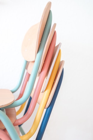 A diverse range of accent chairs in various colors.