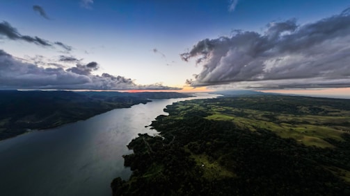 A panoramic view of the Senegal River flowing through the Matam region at sunset.