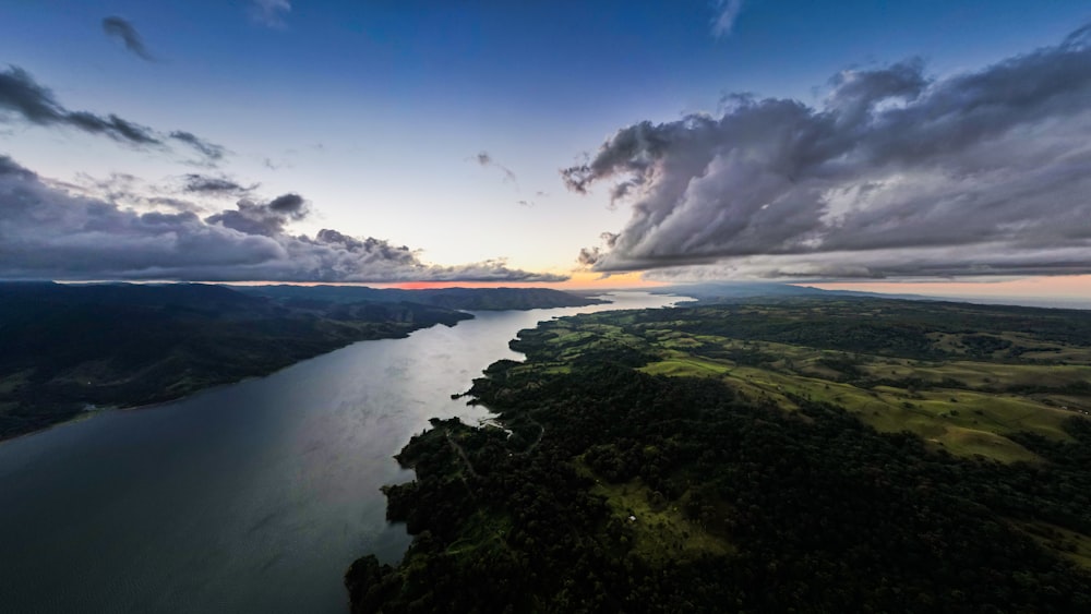 an aerial view of a body of water at sunset