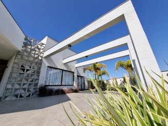 Modern American-style architectural building with sustainable design elements in a sunny California neighborhood.