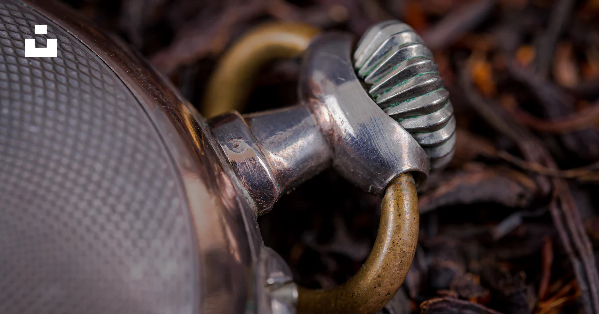 A close up of a metal object on the ground photo – Free Hour Image on ...