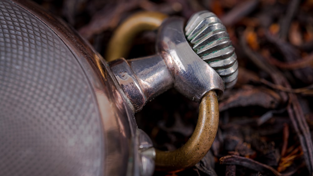 a close up of a metal object on the ground