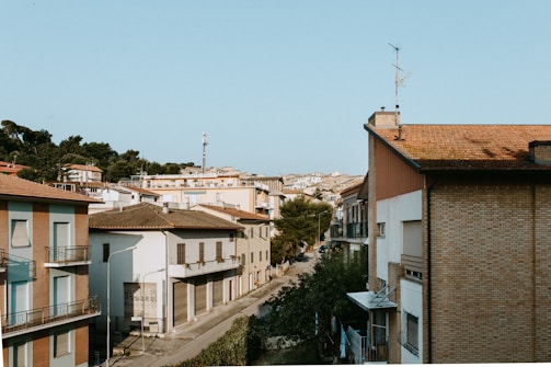 Residential neighborhood with sound monitoring devices on rooftops