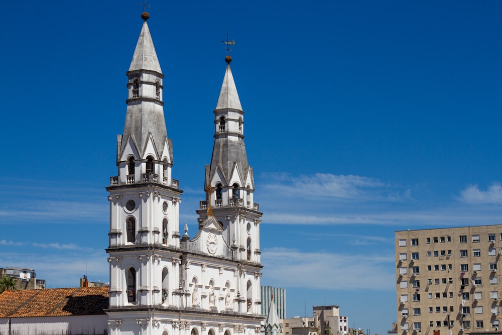 a large white building with two towers on top of it