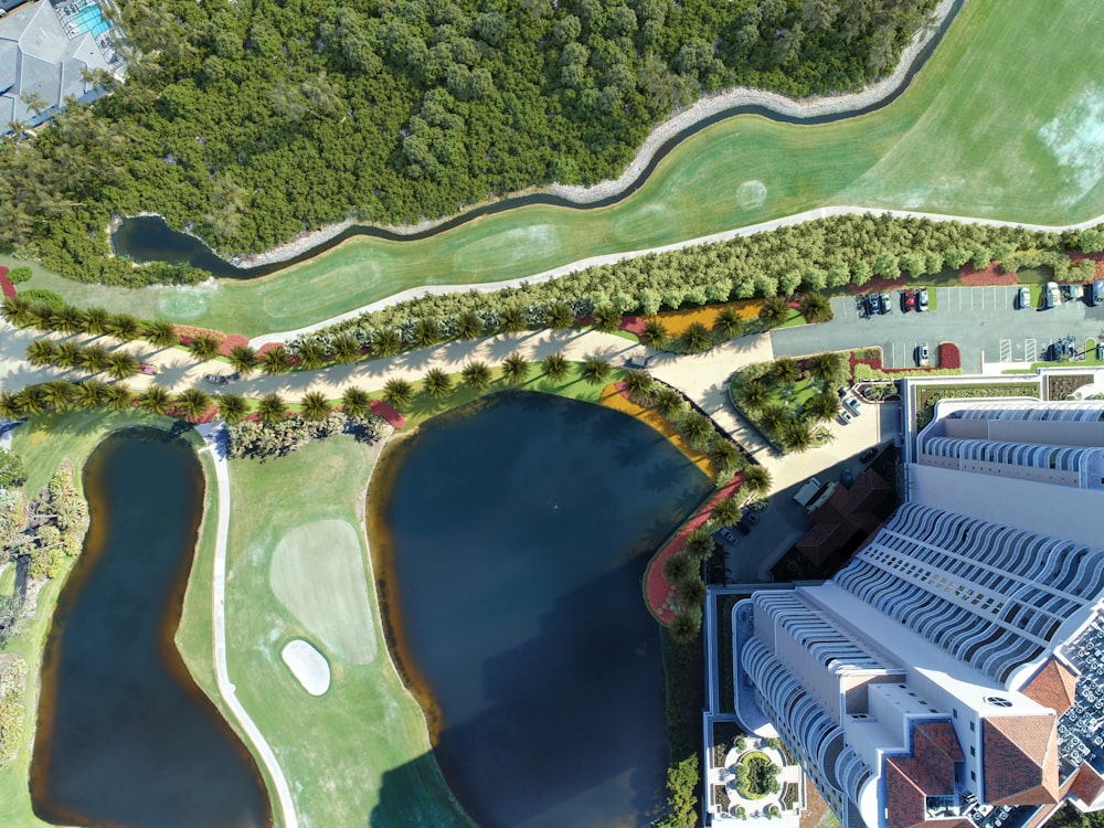 an aerial view of a golf course and a lake