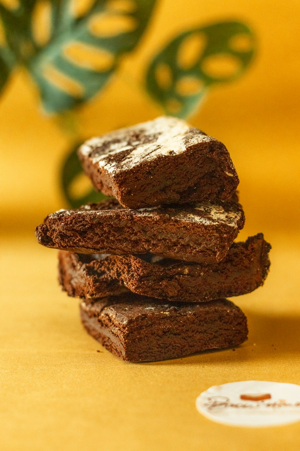 a stack of brownies sitting on top of a table