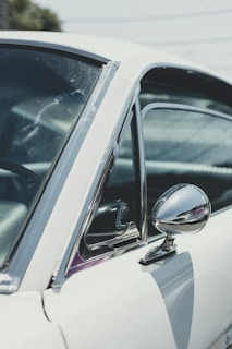 Same car side view after meticulous repair and fresh paint job.