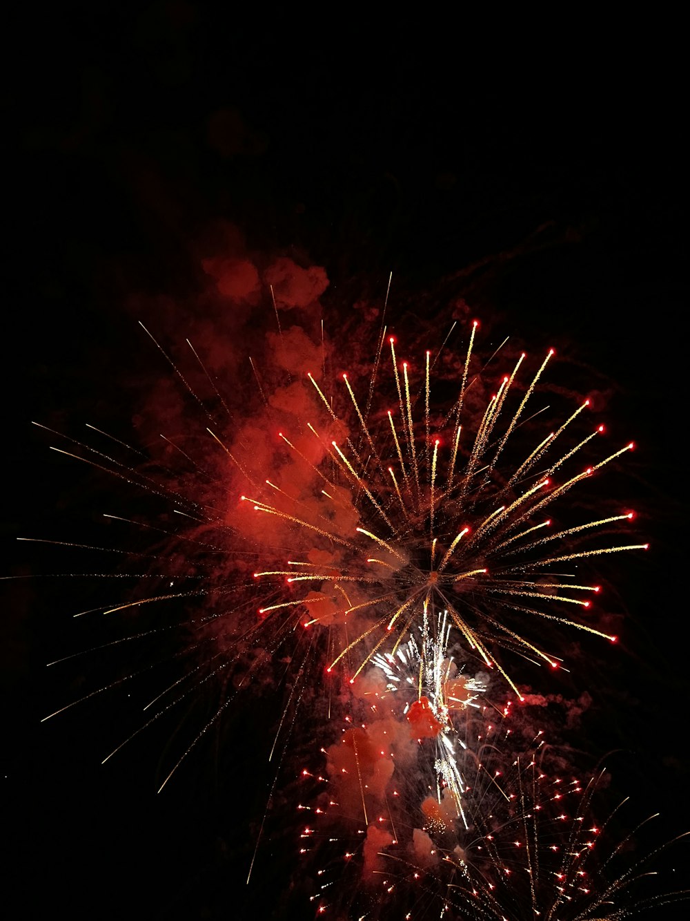 a firework is lit up in the night sky