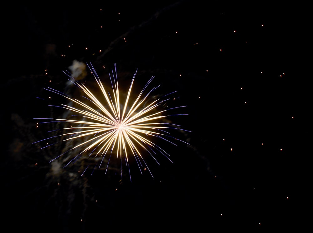 a fireworks is lit up in the night sky