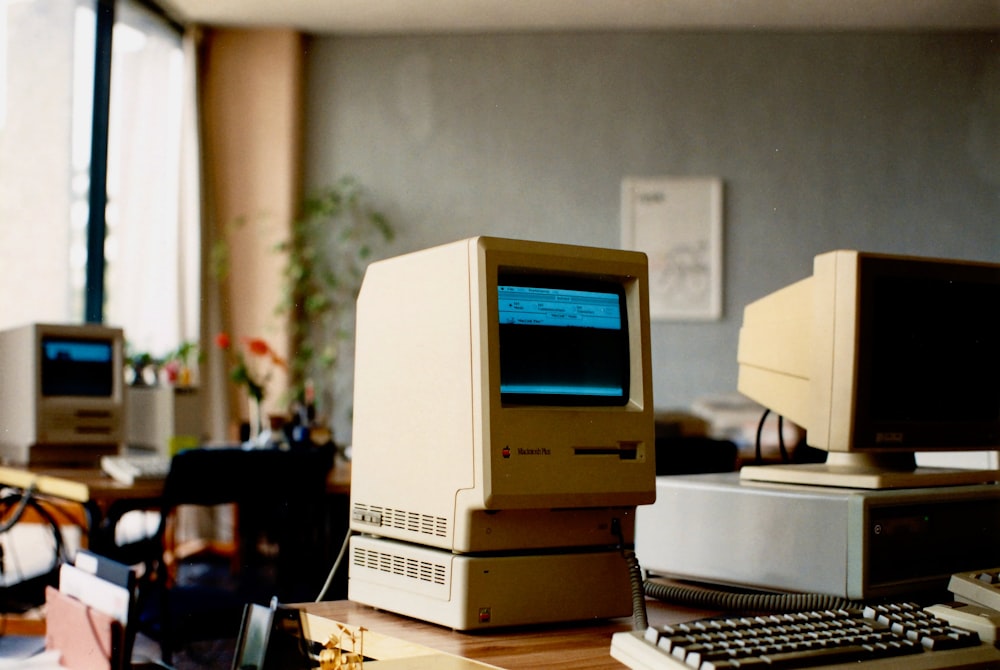 a computer sitting on top of a wooden desk