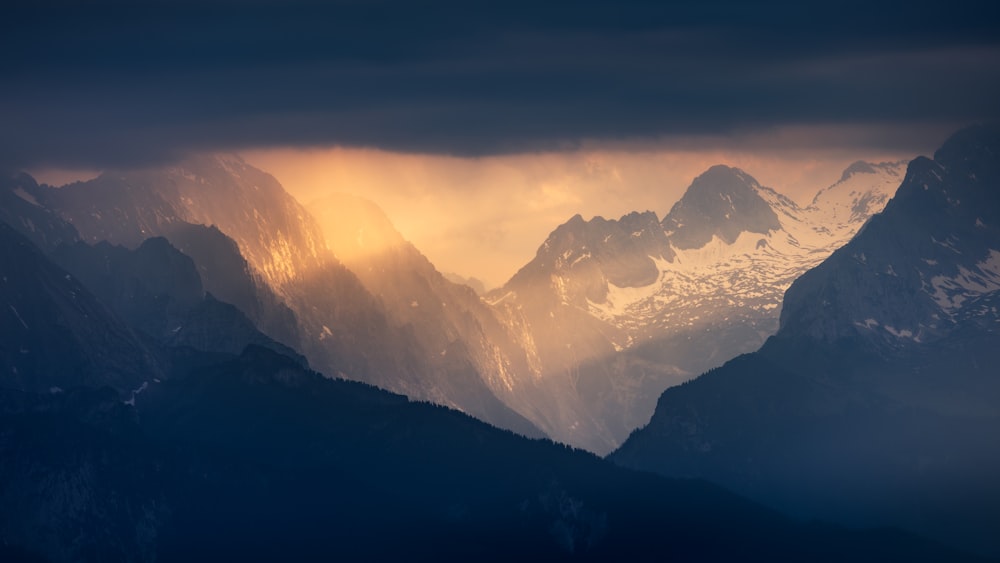 a view of a mountain range at sunset