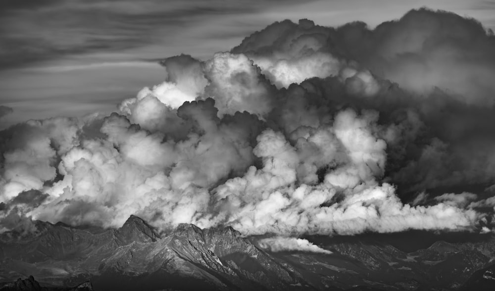 a black and white photo of a large cloud of smoke