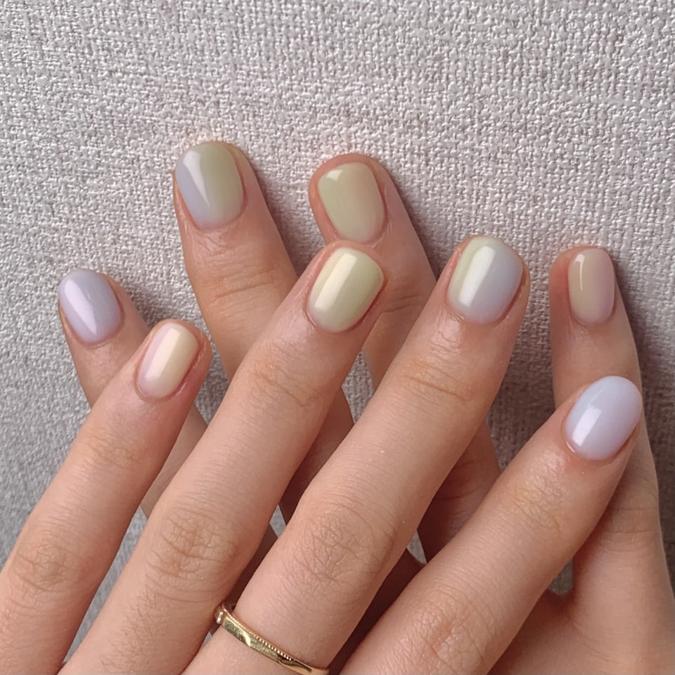 Pastel manicure by a nail professional in a private salon suite