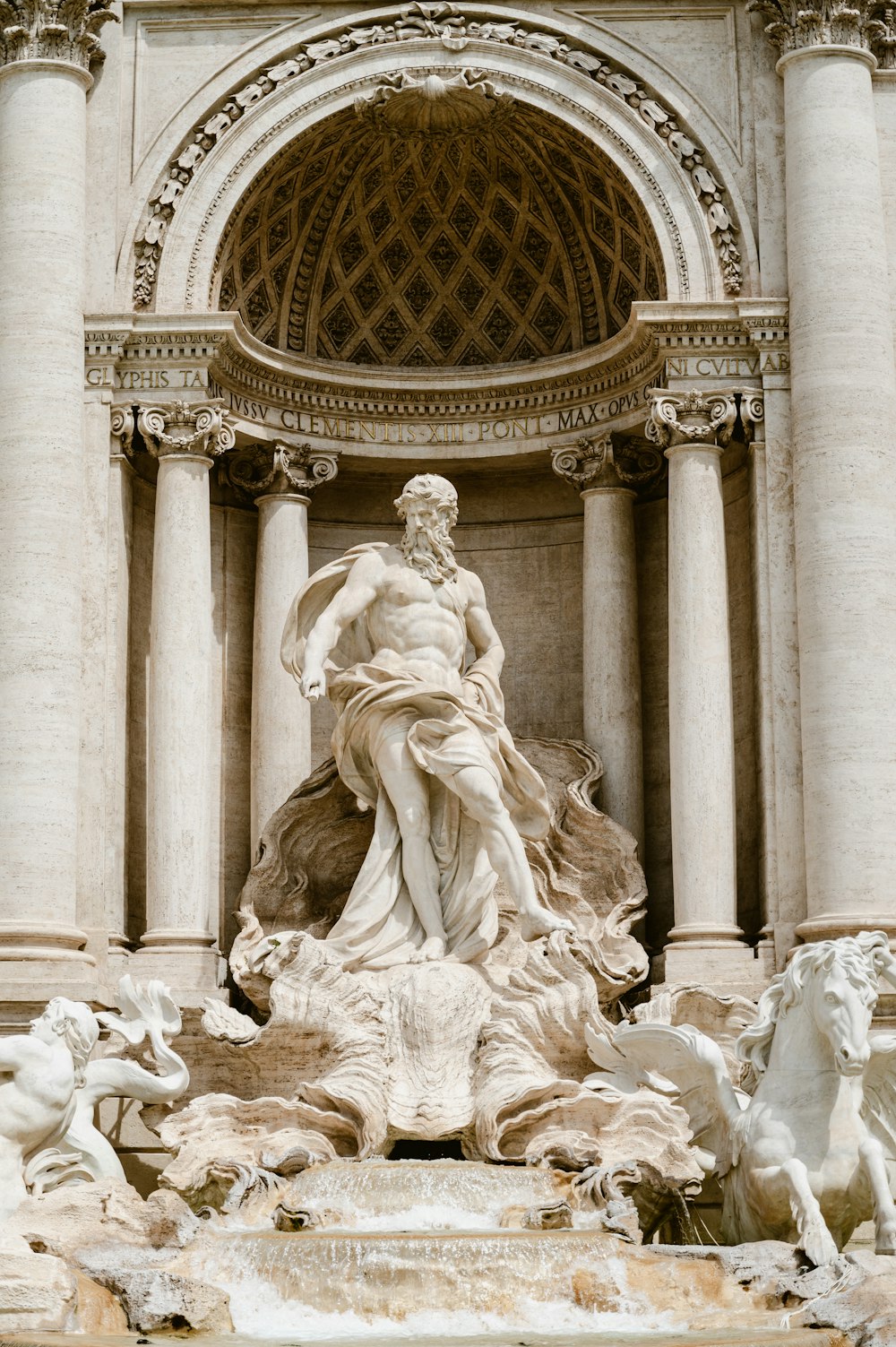 a statue of a woman surrounded by other statues