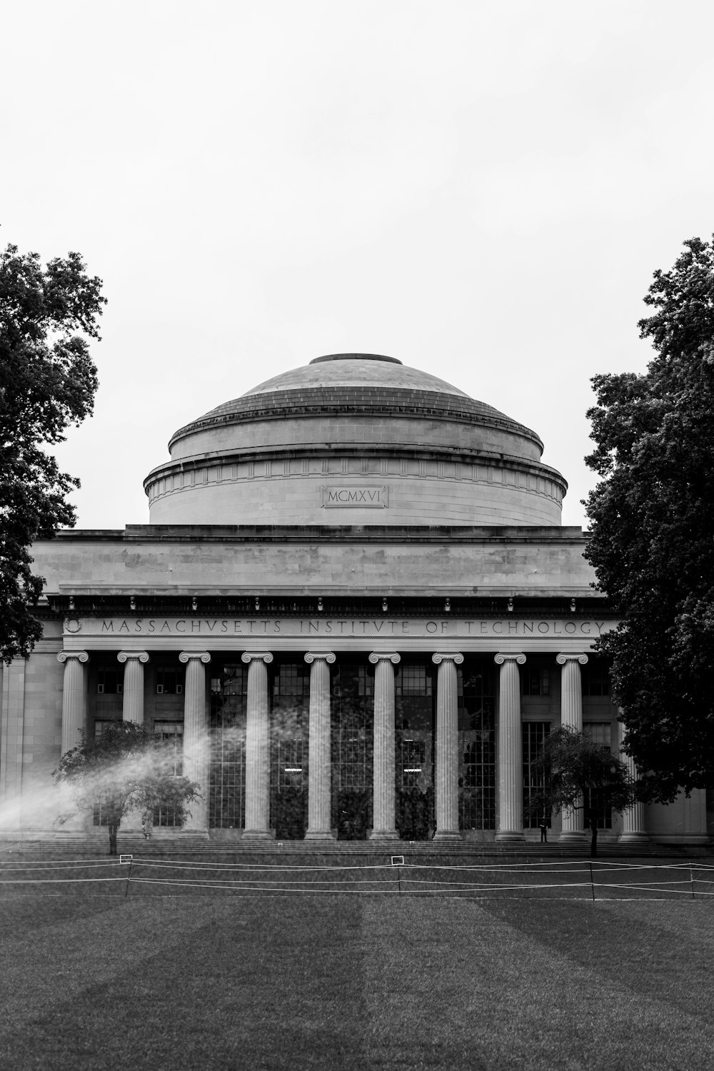 a black and white photo of a building with columns