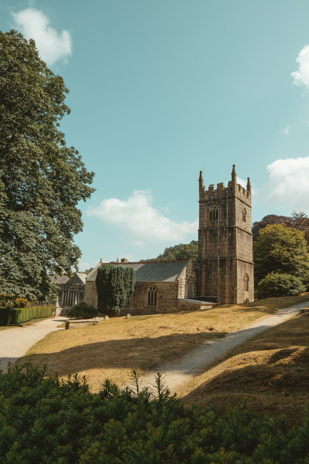 an old church in the middle of a field