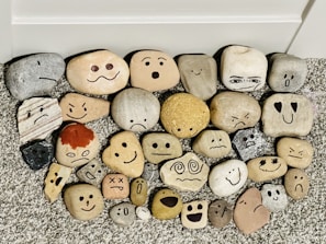 A collection of small sculpted figures representing various emotions.