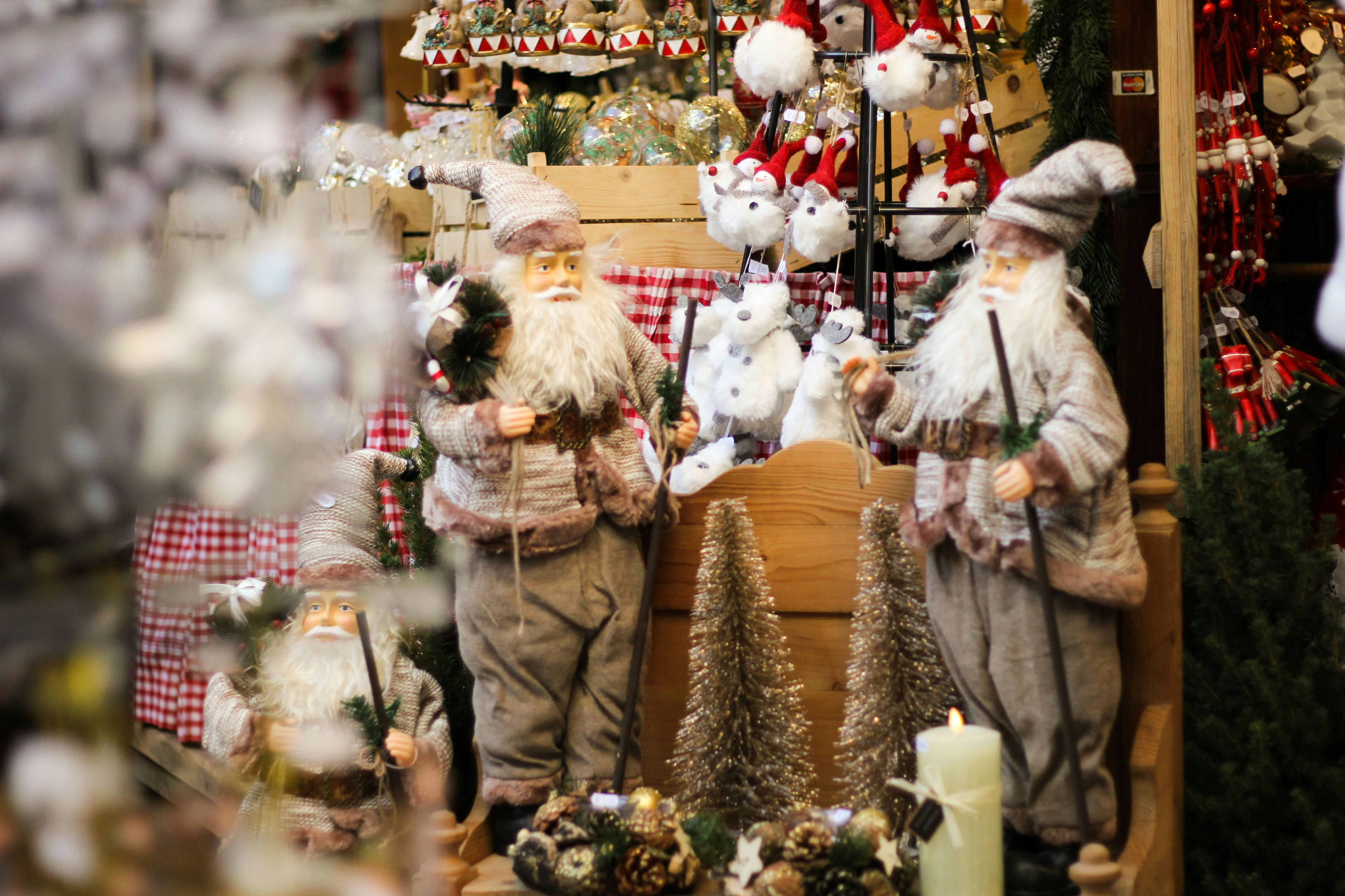 a couple of statues of santa claus in a store