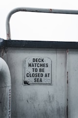 a close up of a metal object with a sign on it