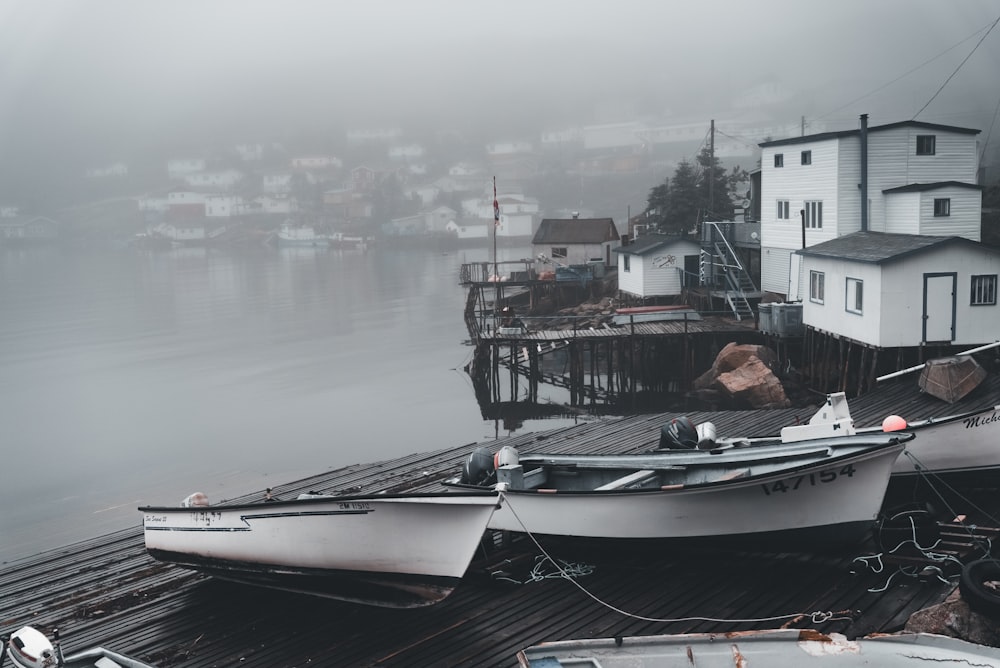 a couple of boats that are sitting on a dock