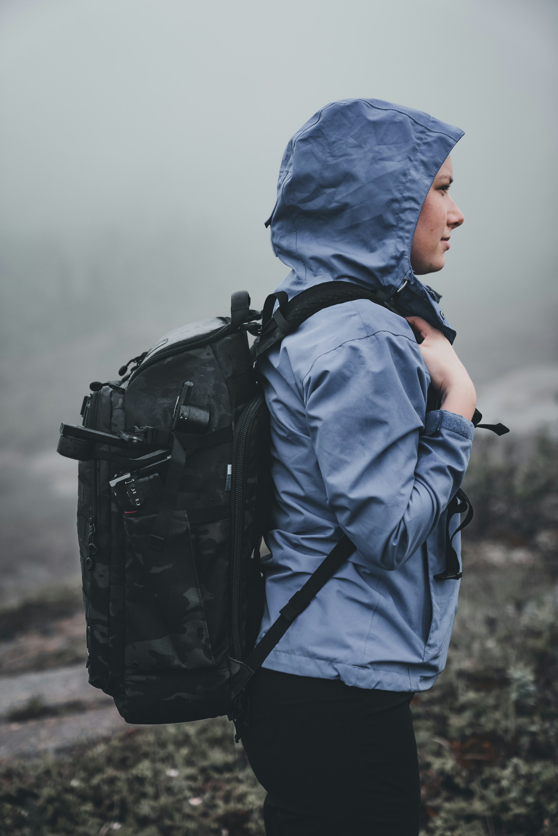a person with a backpack in the fog