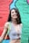a woman standing in front of a colorful wall