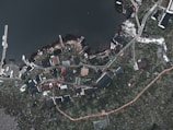 An aerial view of a picturesque village by the coast.