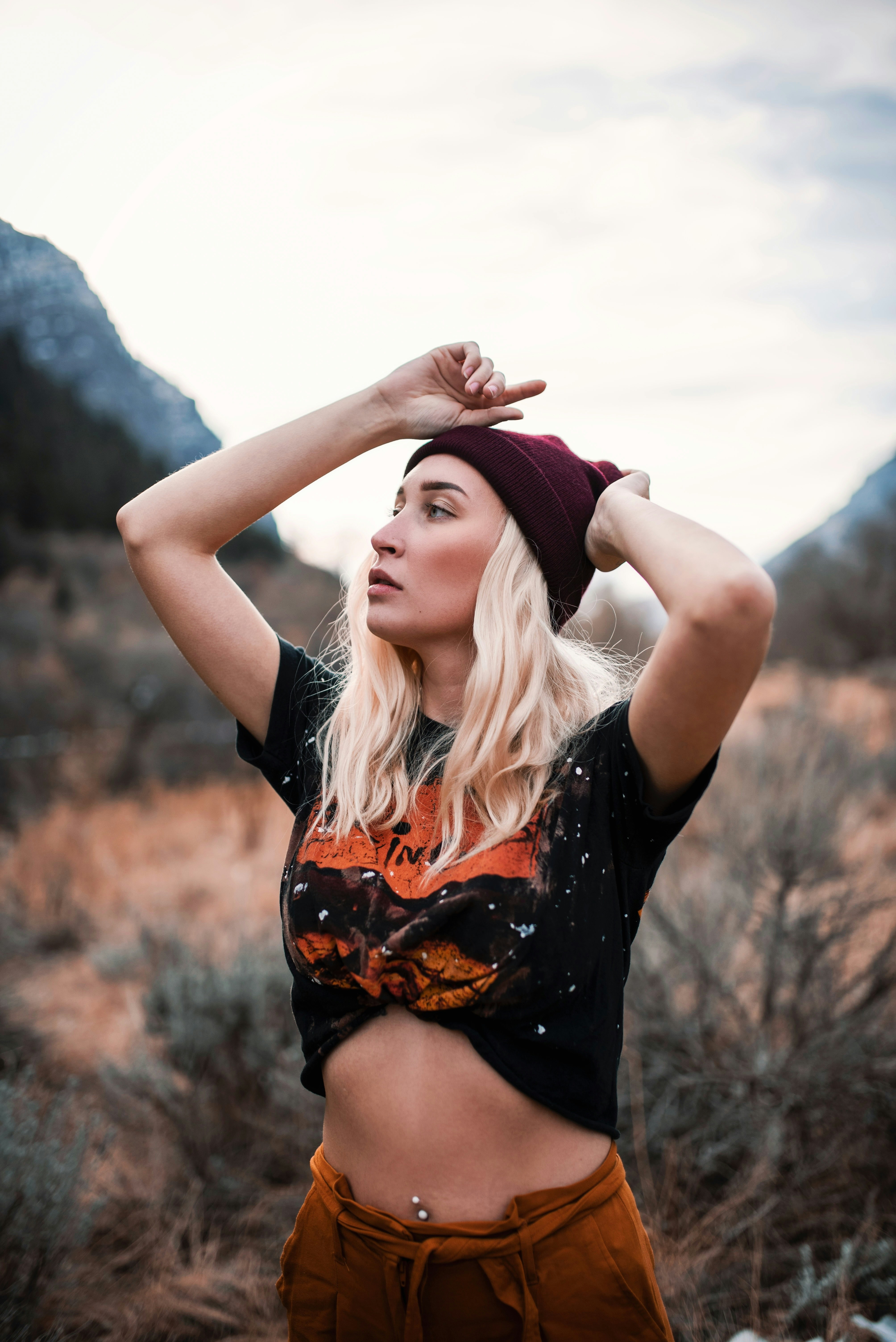 a woman in a black shirt and brown shorts