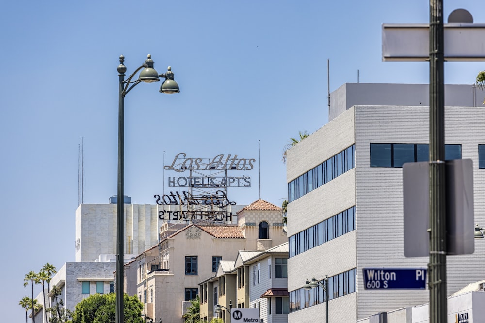 a view of a city street with a hotel sign in the background