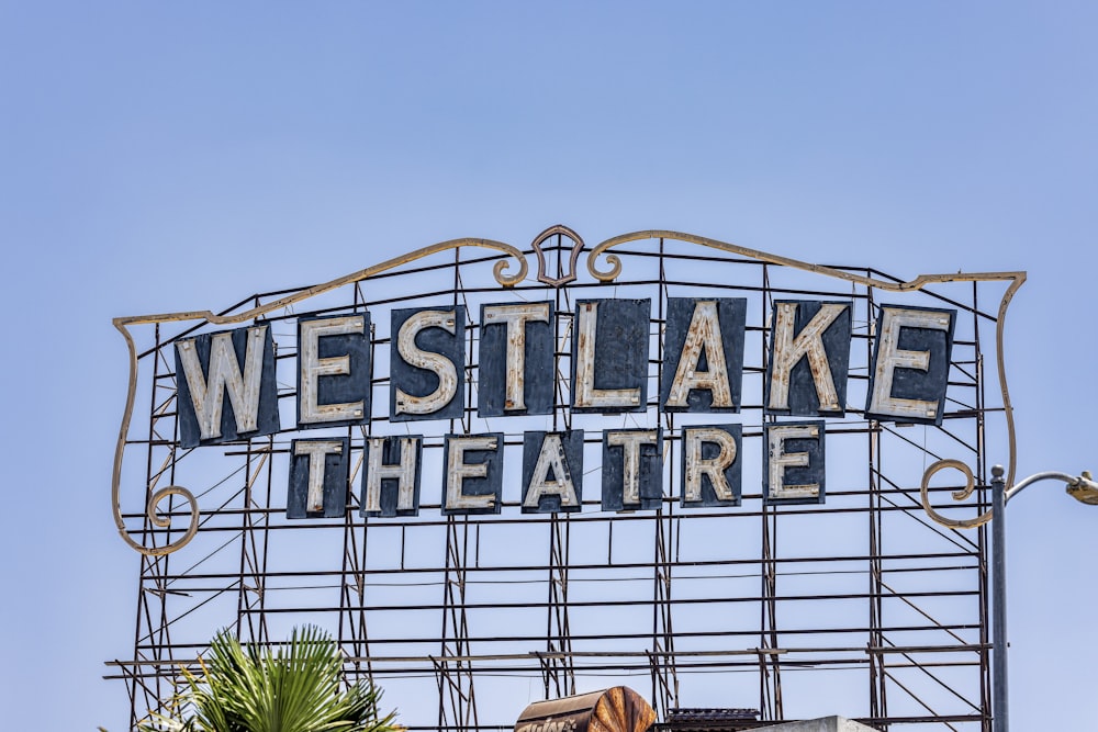 a sign that says westlake theatre on top of a building