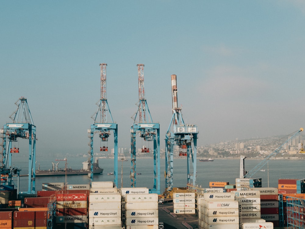 a harbor filled with lots of containers and cranes