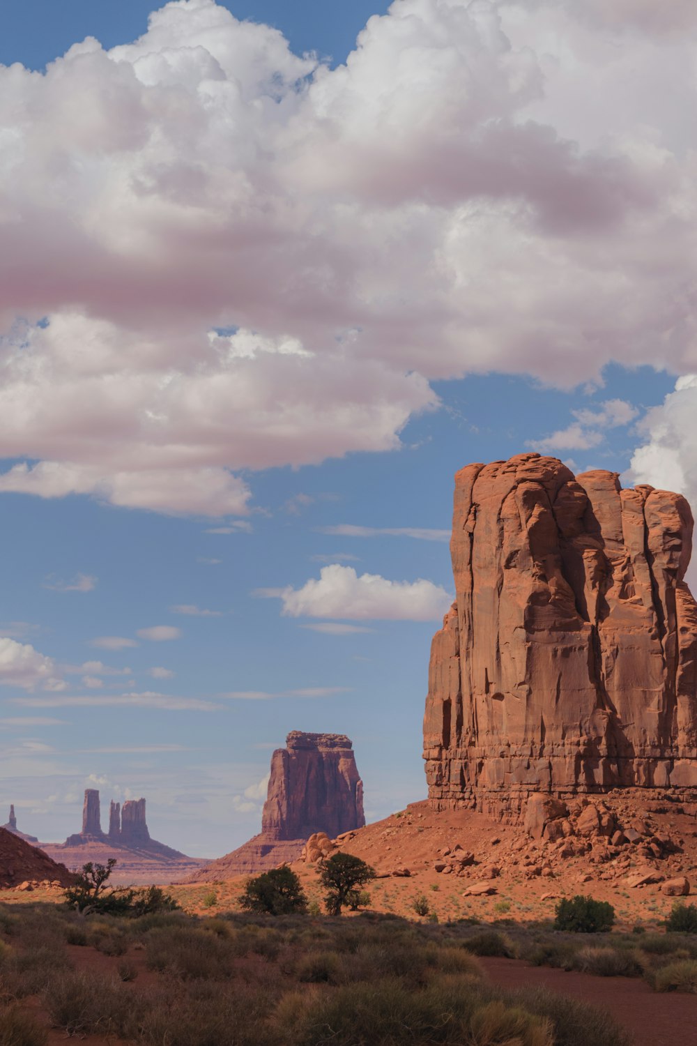 a large rock formation in the middle of a desert