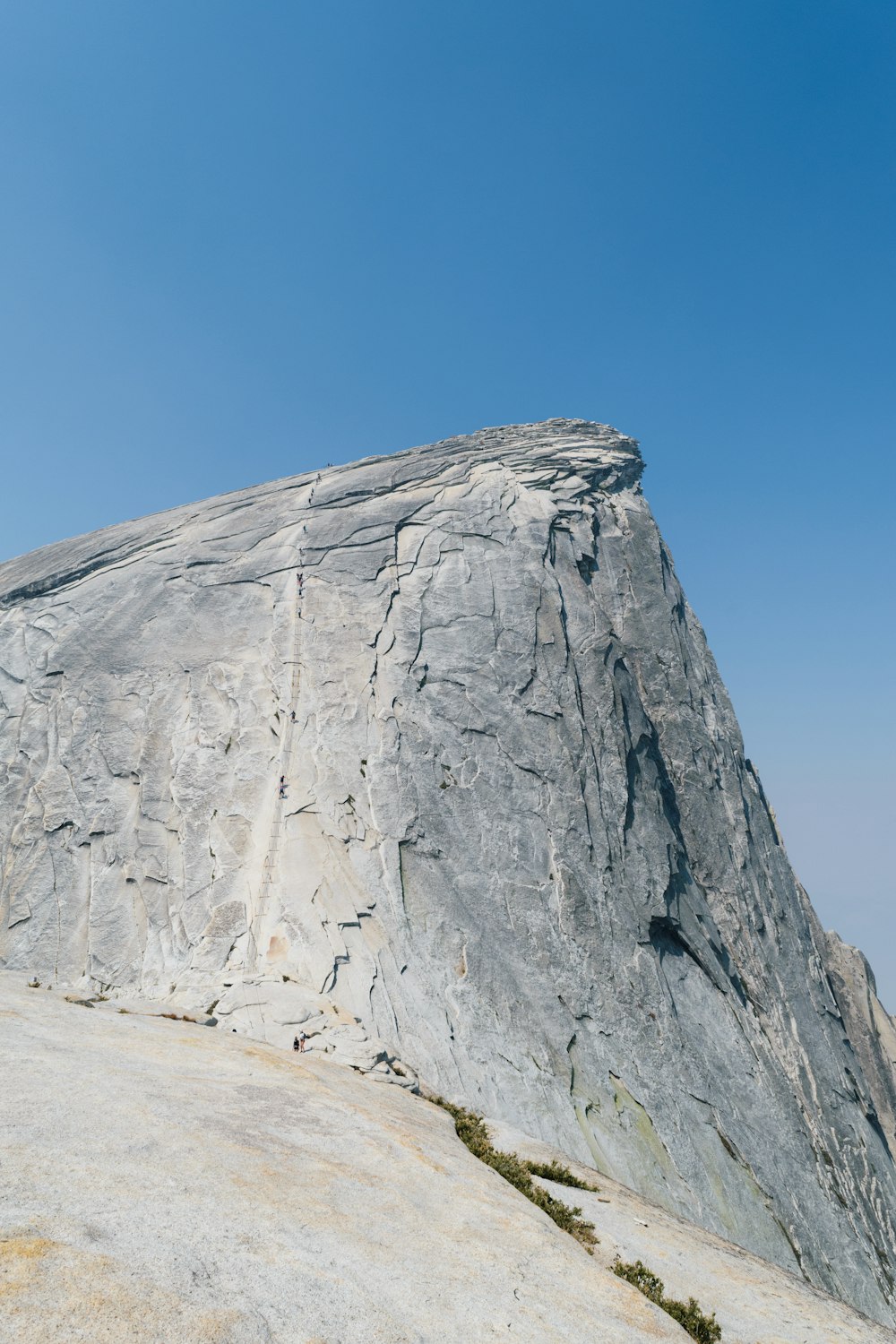 a person standing on top of a large rock