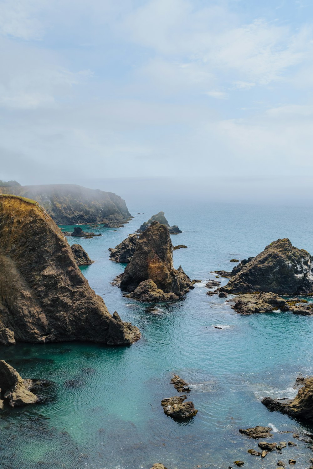 a large body of water surrounded by rocks