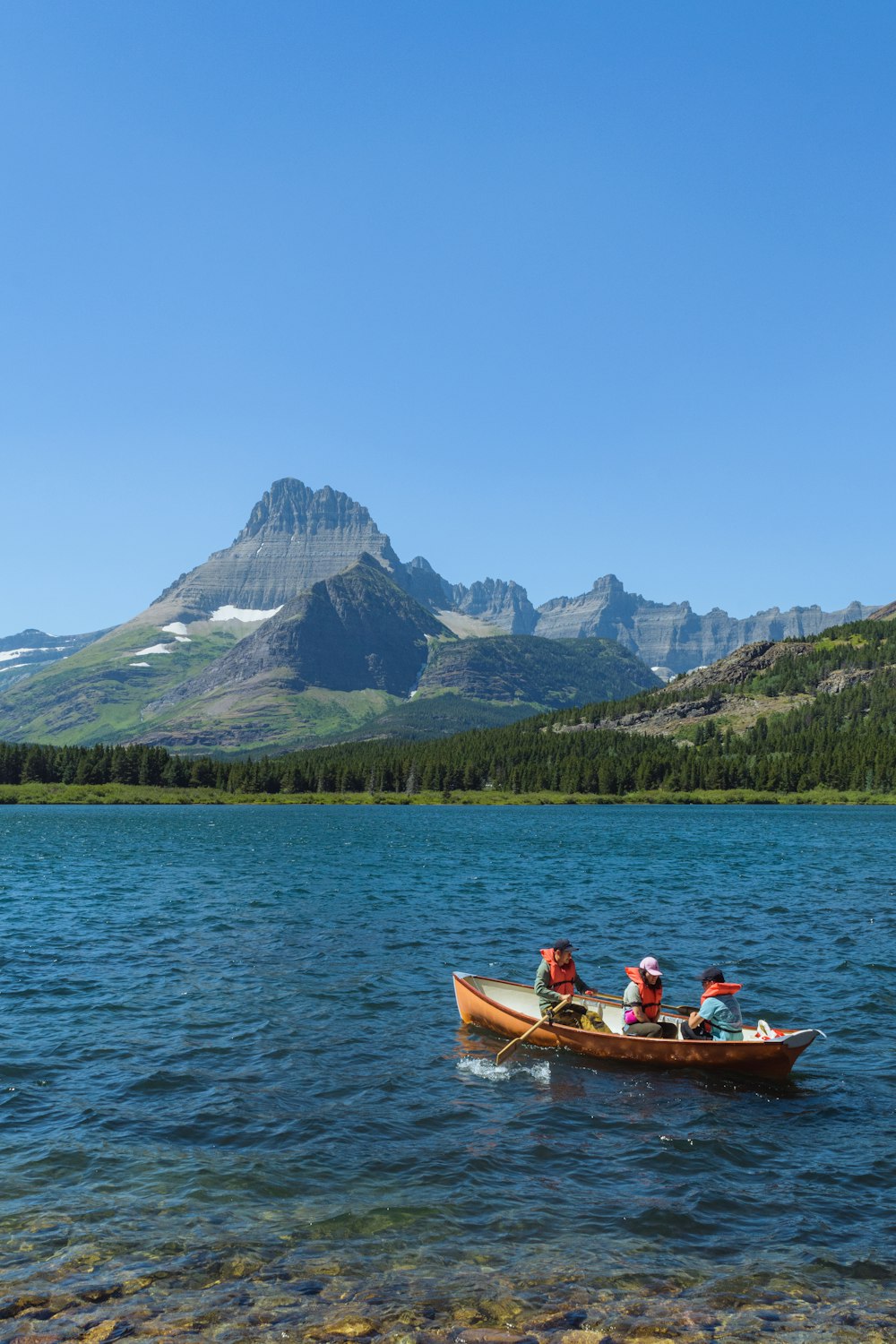 a group of people in a canoe on a lake