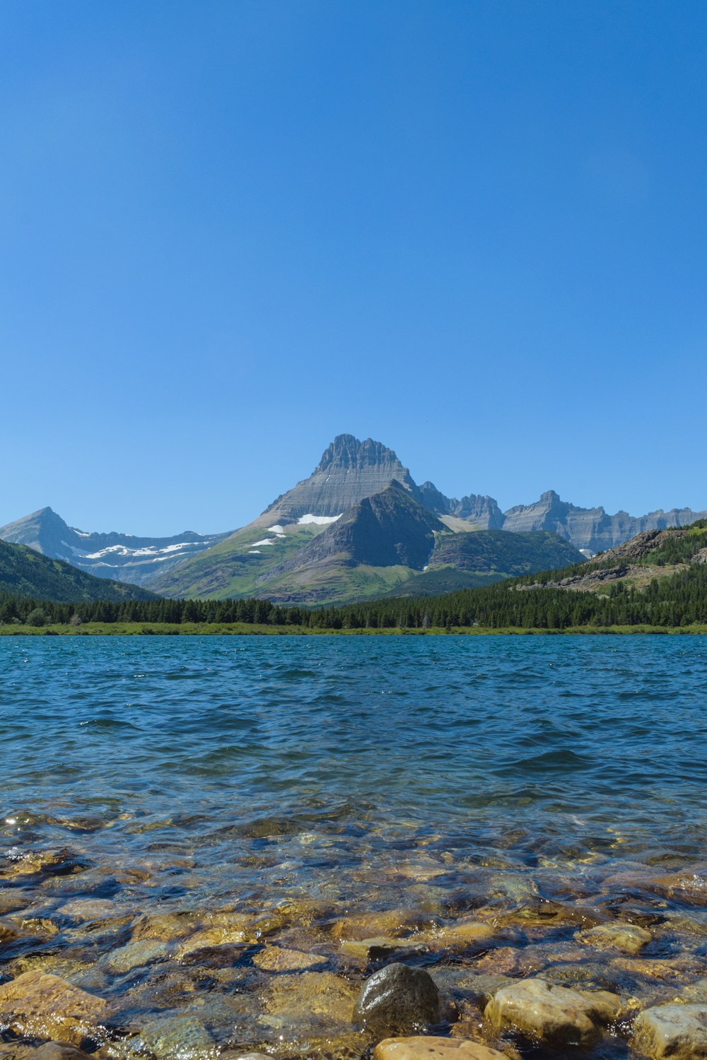 a lake with a mountain in the background