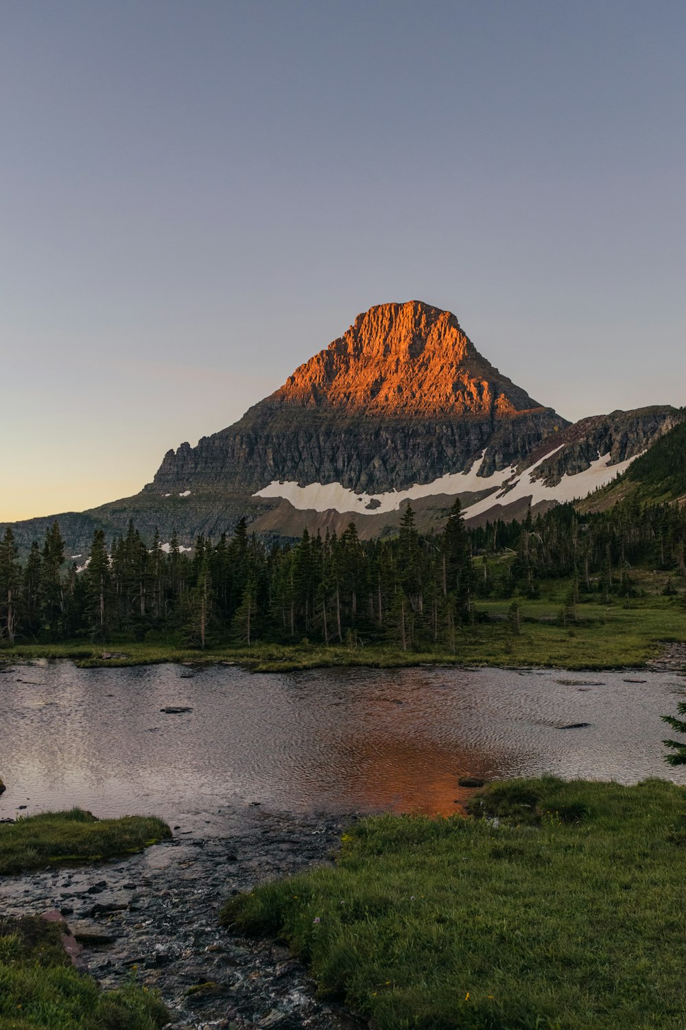 a mountain with a lake in front of it