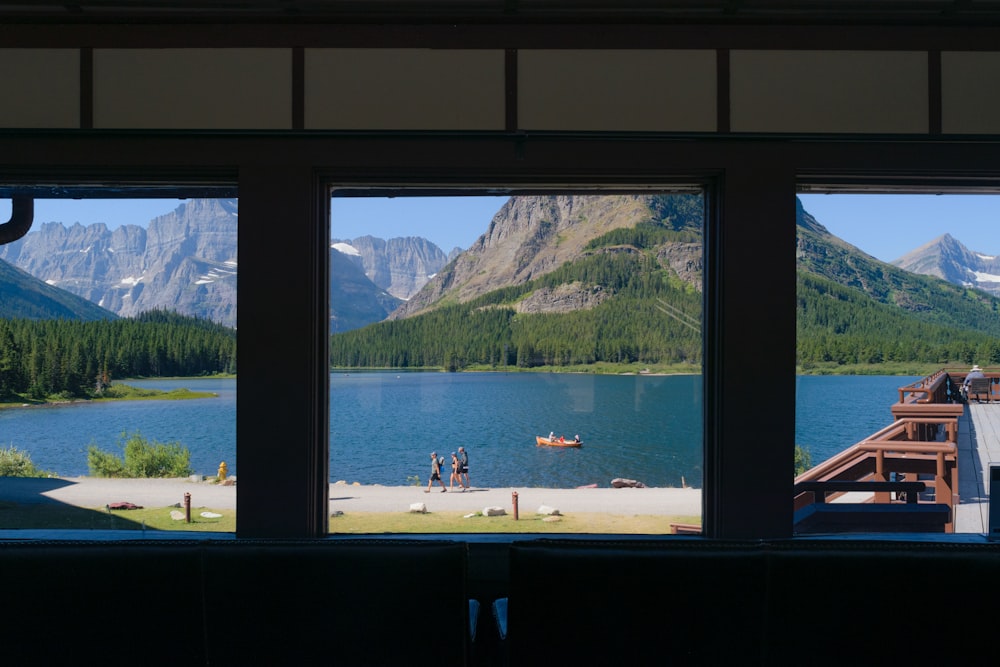 a view of a lake and mountains from a window