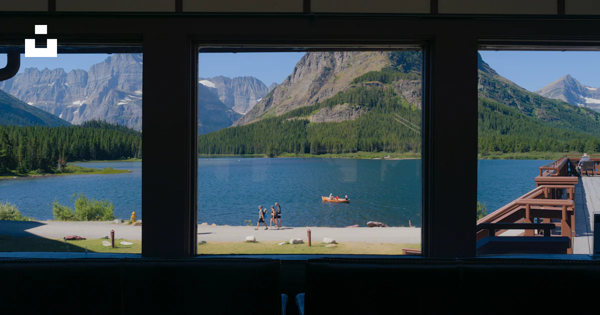 Window Lake A view of a lake and mountains from a window photo – Free Glacier ...