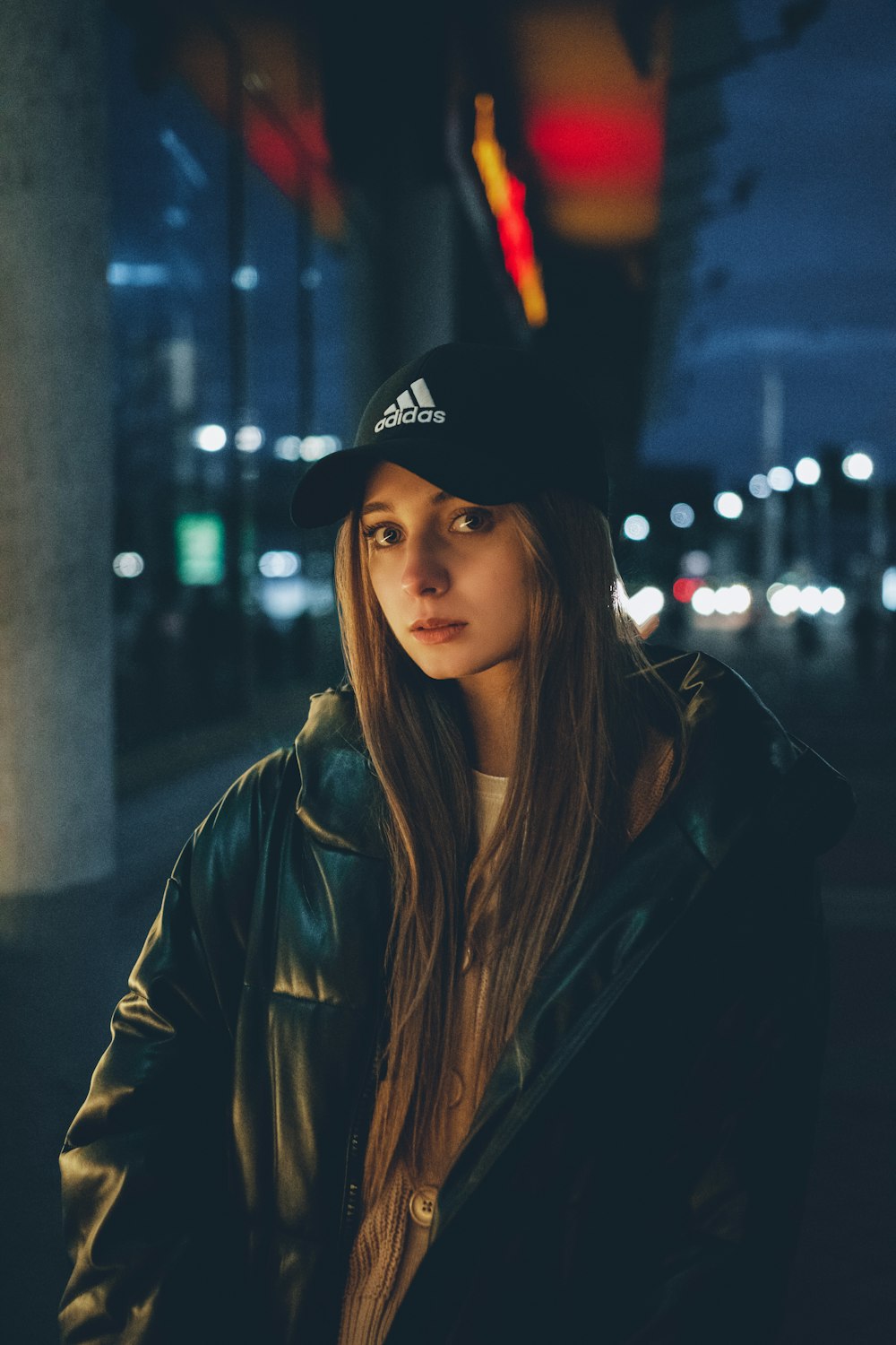 a woman in a black hat and a black jacket