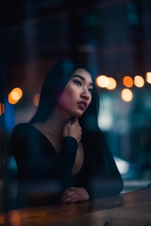 A thoughtful individual gazing into the distance.