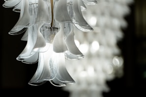 Close-up of a chandelier installation showcasing delicate craftsmanship and precision