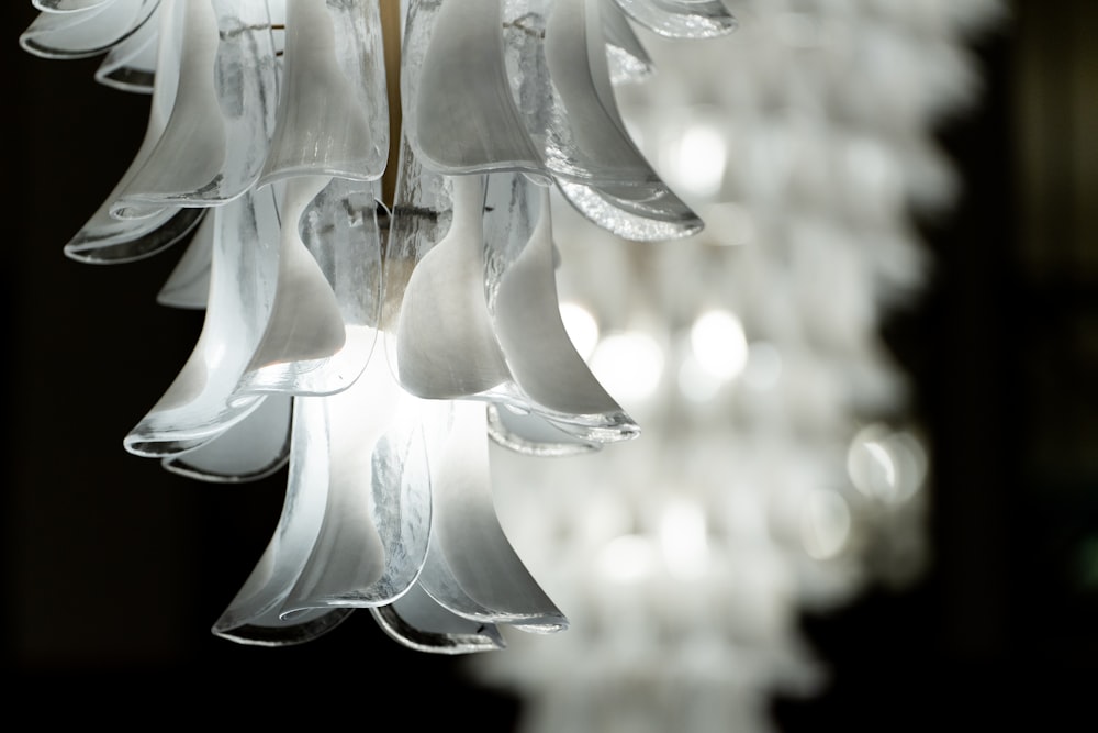 a white chandelier hanging from a ceiling