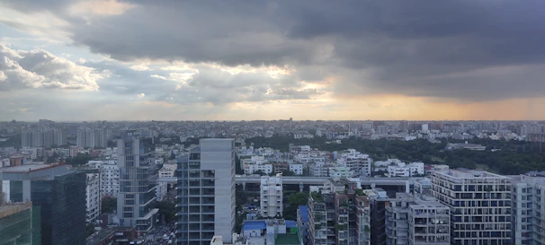 Panoramic view of a sophisticated urban skyline with a cinematic atmosphere.