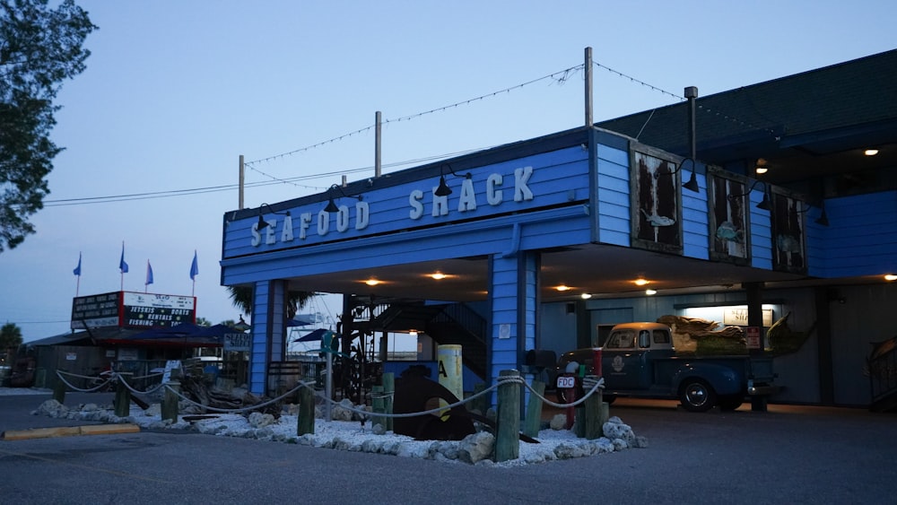 a blue building with a sign that says seafood shack